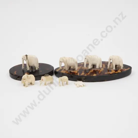 Two Vintage Tortoise Shell and Bone Carved Elephant Mounted Desk Paper Weights and Four Elephant Charms