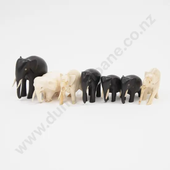 Collection of Three Ivory Elephants and Four Ebony Elephants