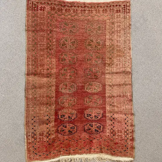 Antique Persian Faded Bokhara Rug