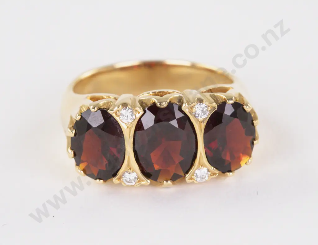 18ct Seven Stone Garnet and Diamond Ring Image 1++
