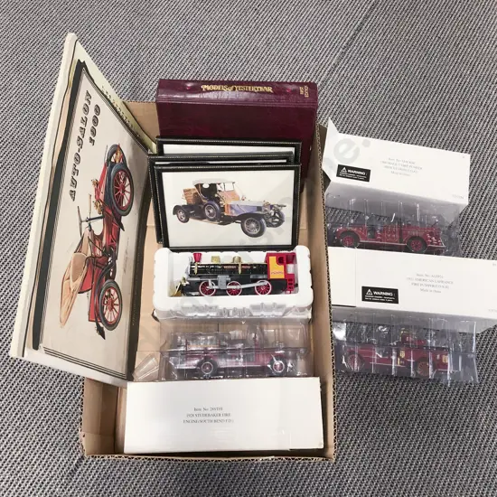 Four Boxed Fire Engine Models with Vintage Artwork and Reference Folder