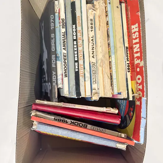 Two Boxes of Assorted Vintage Annuals and Cassette Tapes
