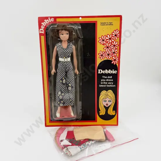 C1975 Debbie Doll on original card with cellophane cover made in NZ 28cm some clothing