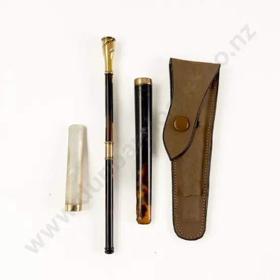 Three 9ct and 14ct Gold Mounted Cigarette Holders