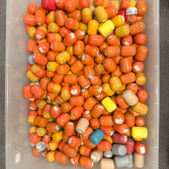 Plastic Storage Bin of Unopened Kinder Surprise Kits