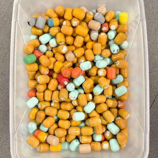Plastic Storage Bin of Unopened Kinder Surprise Kits