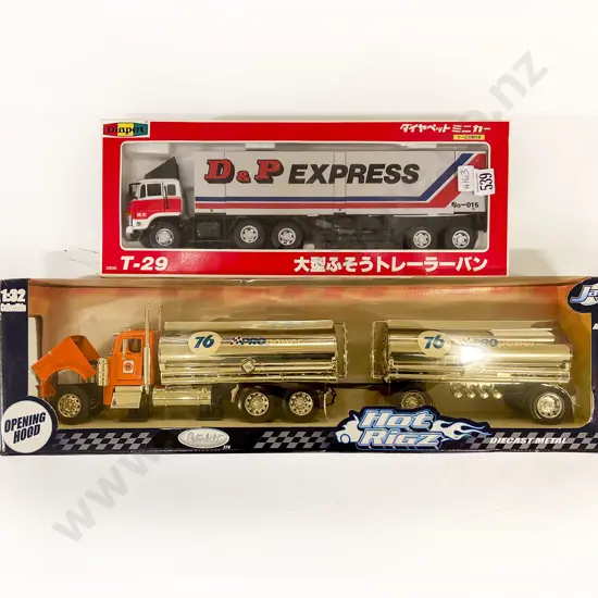 Two Boxed Large Scale Transport Trucks