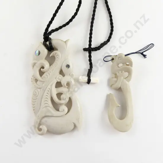 Two Modern Carved Bone Pendants