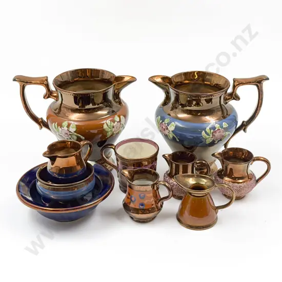 Ten Copper Lustre Jugs and Dishes