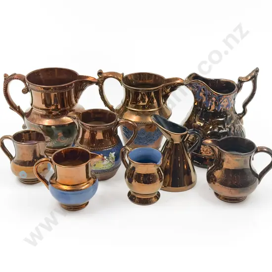 Nine Copper Lustre Jugs