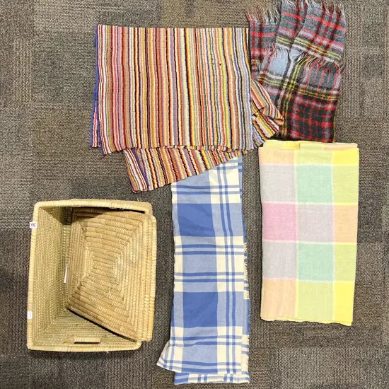 Four Assorted Woollen Blankets in Lidded Basket