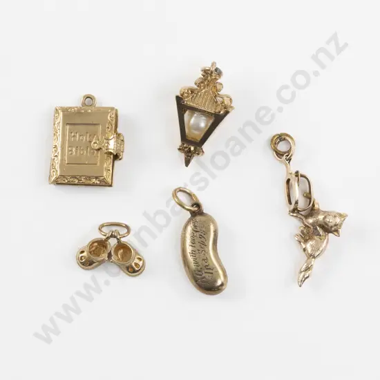 Five 15ct and 14ct Gold Charms
