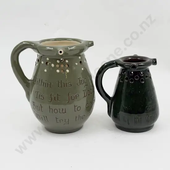 Two Brannam Pottery Motto Puzzle Jugs