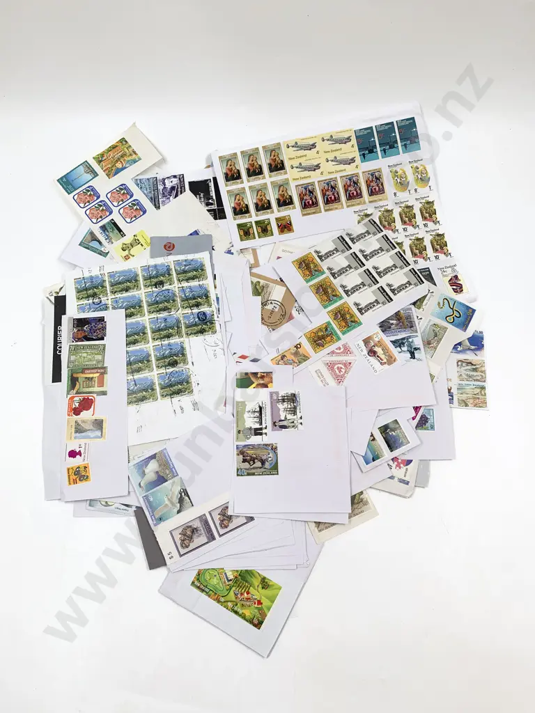 NZ Loose Sorted Stamps and Loose stamps on paper Image 1++