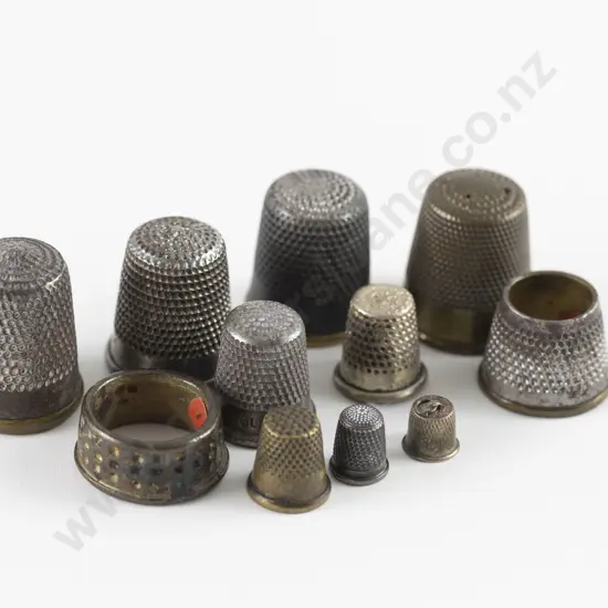 Eleven Antique Metal Family Sewing Box Thimbles including Childs and Two Miniatures