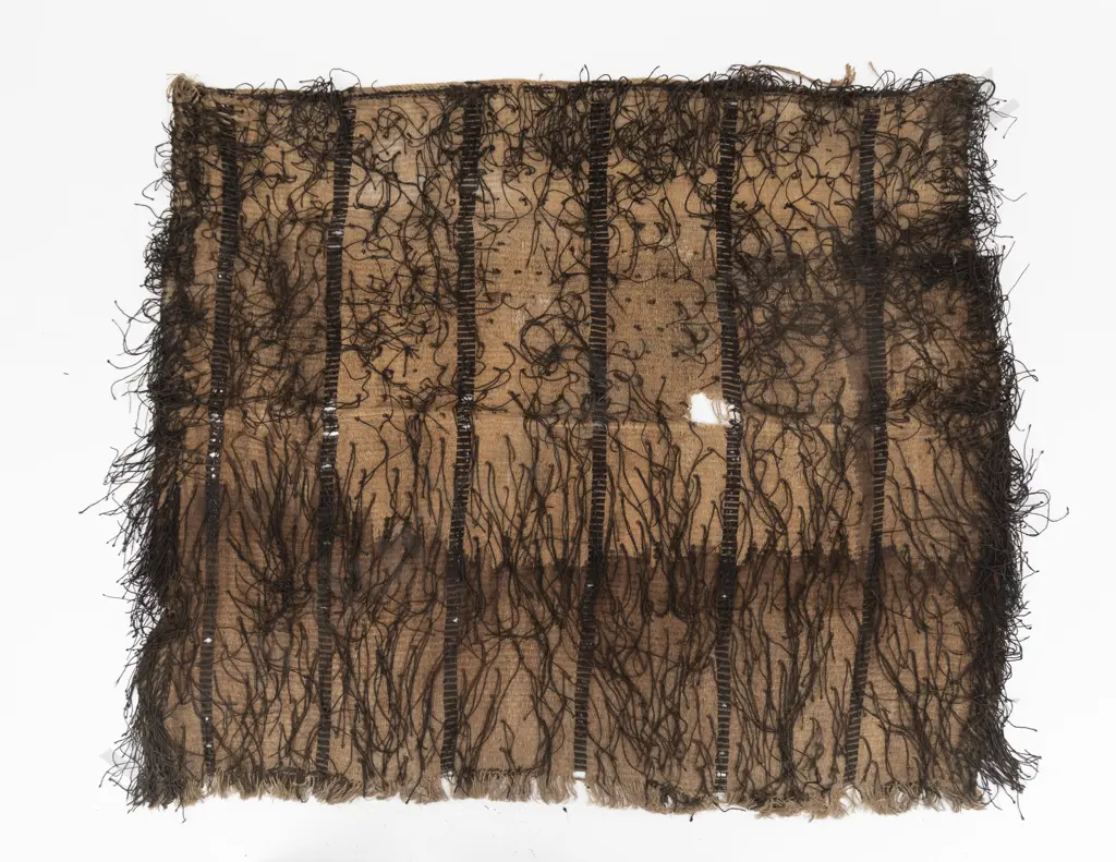 A large korowai (cloak) with hukahuka threads and vertical decorative bands Image 1++