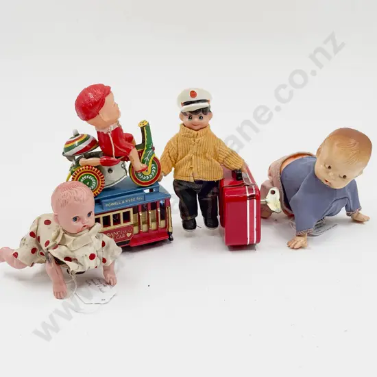 Four Assorted Wind Up Toys and Other