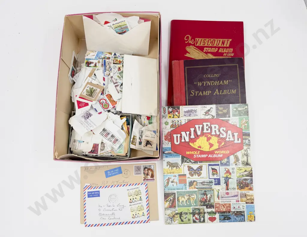 Three Vintage World Stamp Albums with loose unsorted World Stamps Image 1++