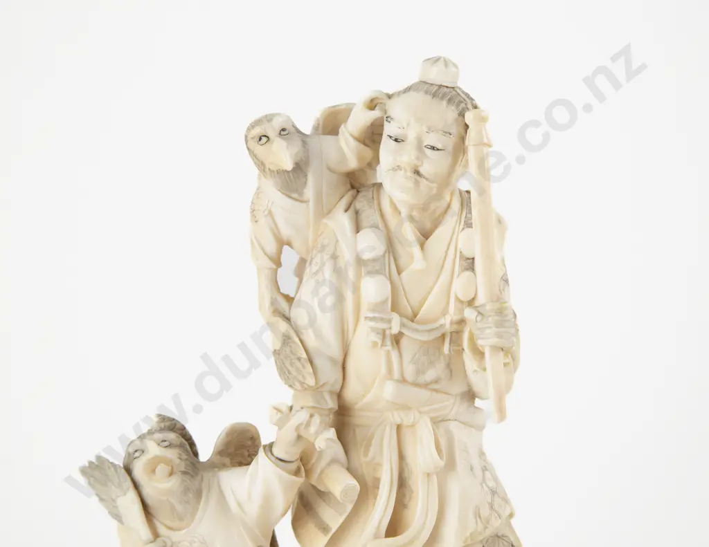 Signed Meiji period (1868–1912) Japanese Ivory Carving of Hunter with Guardian Eagle Attendants Image 1++