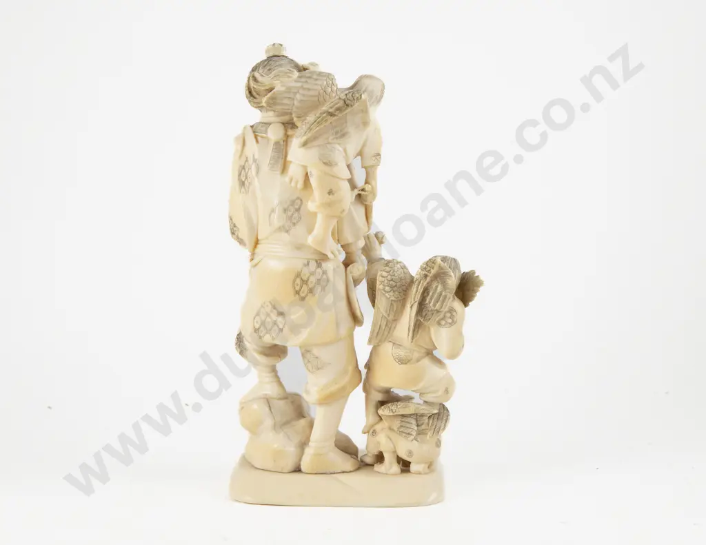 Signed Meiji period (1868–1912) Japanese Ivory Carving of Hunter with Guardian Eagle Attendants Image 1++