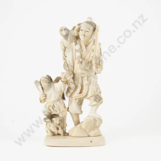 Signed Meiji period (1868–1912) Japanese Ivory Carving of Hunter with Guardian Eagle Attendants