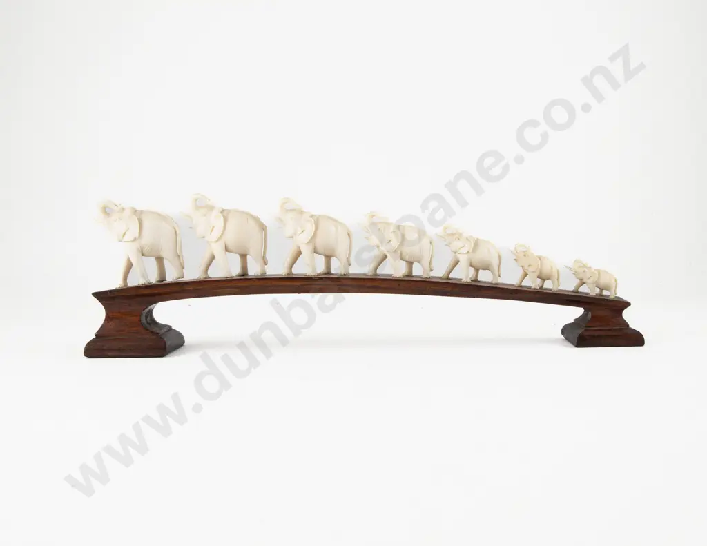 Carved Ivory Seven Elephant Bridge on Teak Stand Image 1++