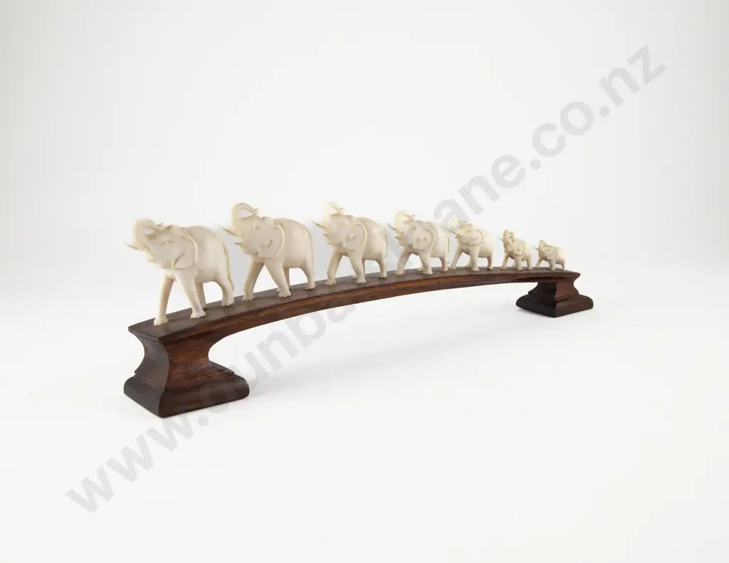 Carved Ivory Seven Elephant Bridge on Teak Stand Image 1++