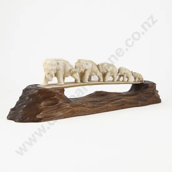Carved Ivory Five Elephant Bridge on Adzed Fruitwood Stand