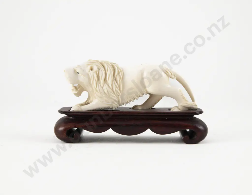 Carved Ivory Lion on Stand Image 1++
