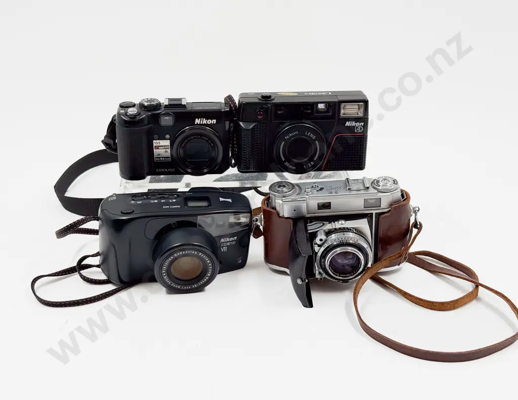 Kodak Retina III and Three Nikon Cameras Image 1++