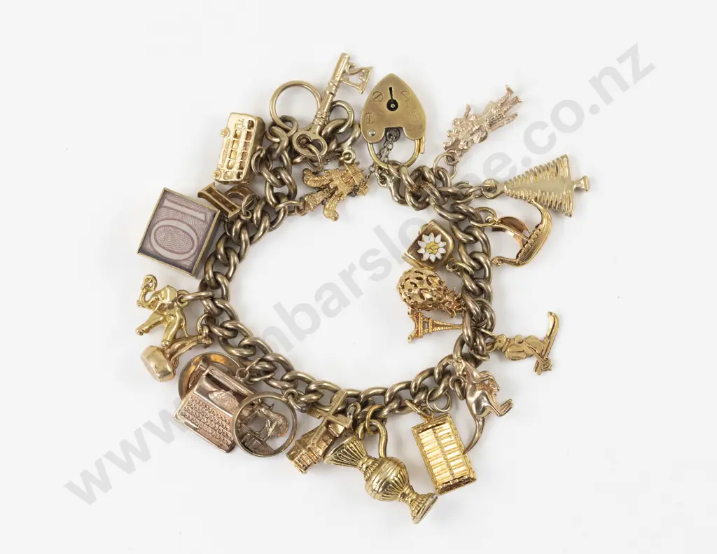 22 9ct 14ct and 18ct Charms on a Curb Link Charm Bracelet Image 1++