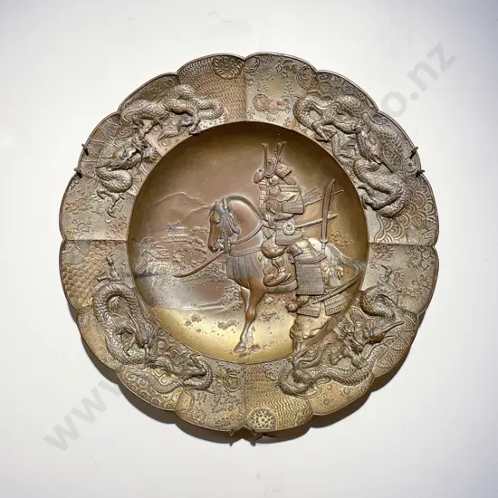 Japanese Metal Wall Hanging Charger Depicting A Samurai on Horseback in Relief