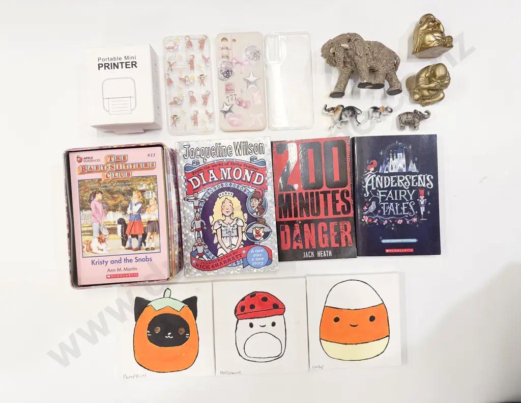 Portable Mini Printer With Collection of Books Phone Cases and Assorted Image 1++