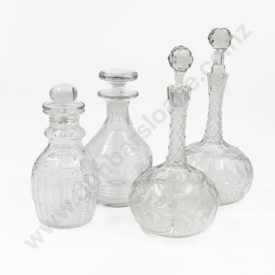 A Pair of Etched Glass Decanters together with Two Crystal Decanters