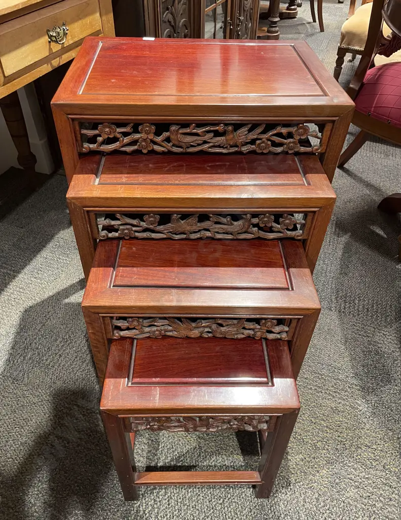 Nest of Four Carved Teak Occ. Tables Image 1++