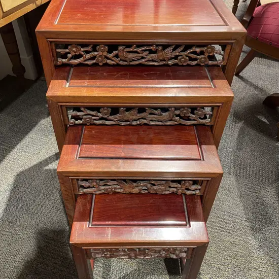 Nest of Four Carved Teak Occ. Tables